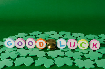 Saint Patrick's Day decoration. Good luck made from colorful letters and clovers on green background