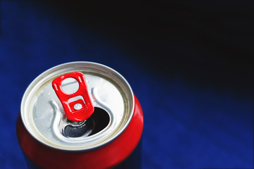 open aluminum can on dark background