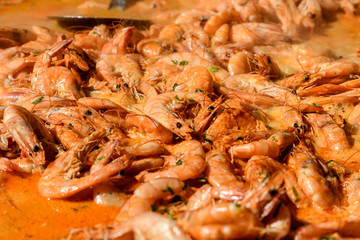 Close up of cooked shrimps at a street food festival, ready to eat seafood
