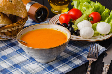 traditional warming pumpkin soup, homemade with bread and antipasti
