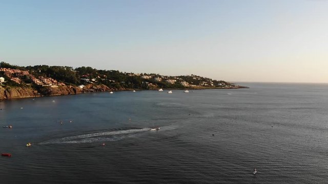 Aerial shot in slow motion at sunset of the beautiful Solanas beach in Punta del Este, Uruguay