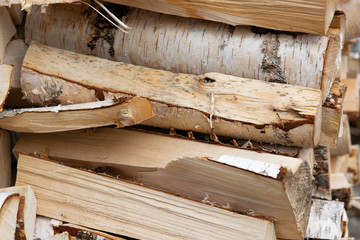 pile of wooden logs, stack of chopped birch firewood