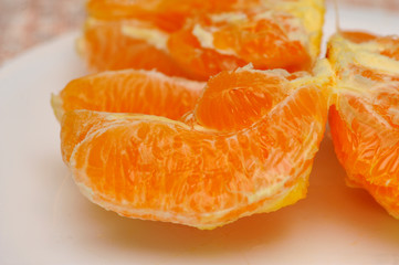 Slice of fresh orange fruit. Macro shoot of fresh orange. Orange background