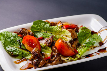 salad with chunks of meat and dressing