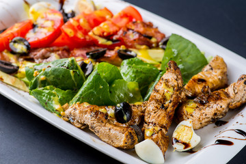 salad with chunks of meat and dressing