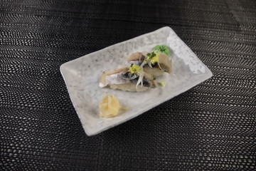Set of sushi and maki roll on stone table. Top view with copy space