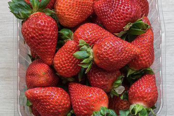 set of fresh strawberries in a box before eating