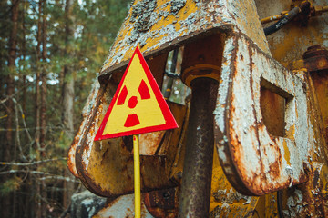 Radiation Sign - triangular warning yellow sign of radiation hazard in the zone of radioactive...