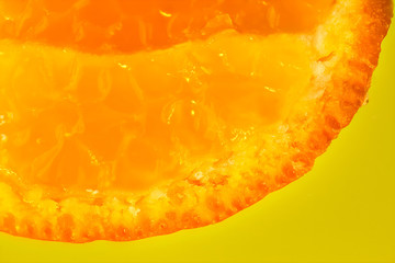 tangerine close up baclground on yellow