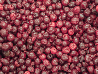 Frozen cherry in the refrigerator in the store