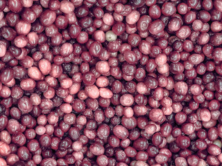 Frozen red berries in the refrigerator in the store