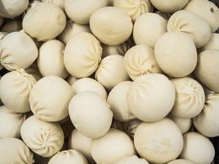 Frozen khinkali in the freezer in the store