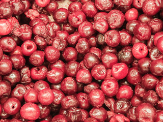 Frozen cherry in the refrigerator in the store