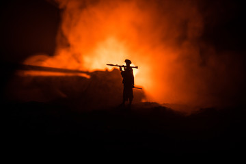 Military soldier silhouette with bazooka. War Concept. Military silhouettes fighting scene on war...