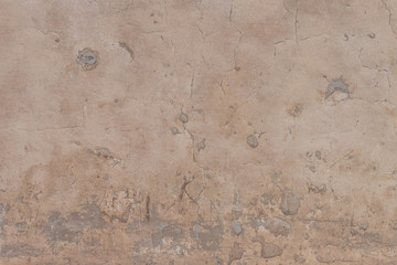 old cracked plaster on the wall