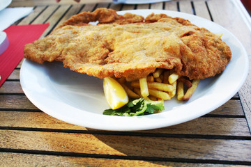 Viennese schnitzel with French fries.