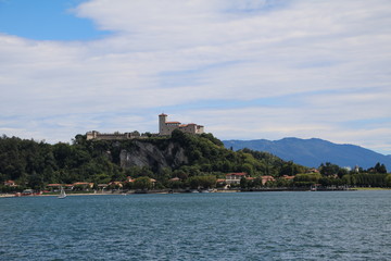 Fototapeta na wymiar Rocca d'Angera in Angera view from Arona at Lake Maggiore, Italy