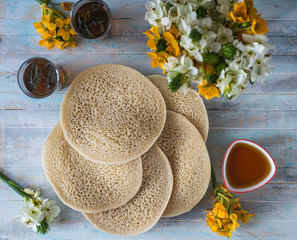 Moroccan pancakes Baghrir or crapes with 1000 holes served with honey, tea with nana , with...