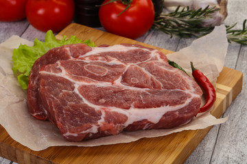 Raw pork neck steak
