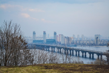 Beautiful view of the river and of Kiev, Ukraine. Sunny spring day. Bridges and city architecture. Landscape.