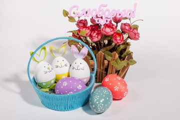 Colorful Easter eggs on white background. The inscription in Russian with Love. Easter holiday.