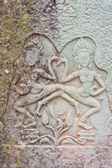 Sculptures of ancient  khmer  carve  the wall into a dancing  angel.