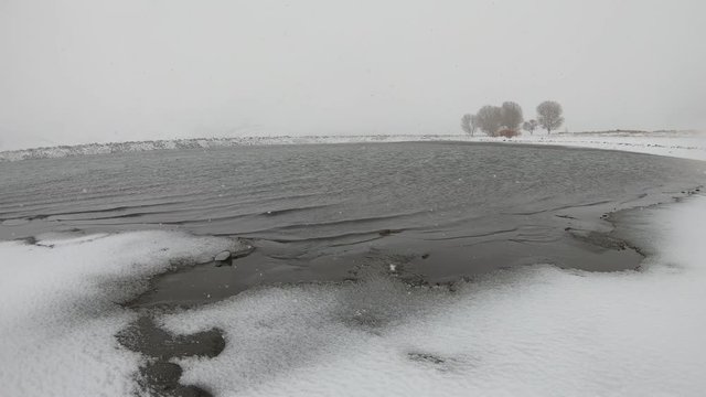 Brite Lake gently rippling in Snow Covered Landscape, Tehachapi, California