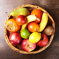 Fresh mixed exotic fruits in basket. Fruits background. Healthy eating, dieting.