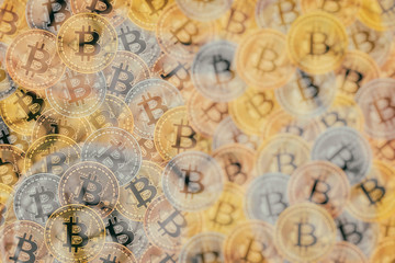 Doeble exposure of Many bronze, silver and gold coins with Bitcoin sign, It is a cryptocurrency background.