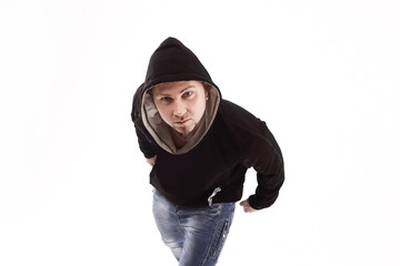 top view. stylish rapper guy looking at camera . isolated on white