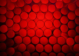 Abstract red colorful background of stack pipes
