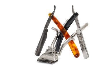Old manual hair clipper and vintage straight razor isolated  on white background. Barbershop tools