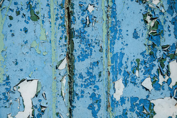 Texture of metal rust of old paint. The background is blue, reddish and light green. Iron corrosion.