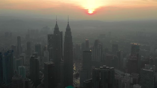 Drone scene fly over truck movement Aerial Kuala Lumpur city, Petronas Tower, Malaysia in sunrise morning 4k video