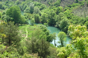 Fototapeta na wymiar Landscape with river and trees in Bosnia