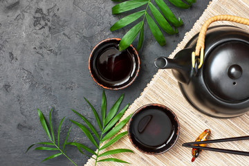 Green asian tea on stone table. Top view with copy space