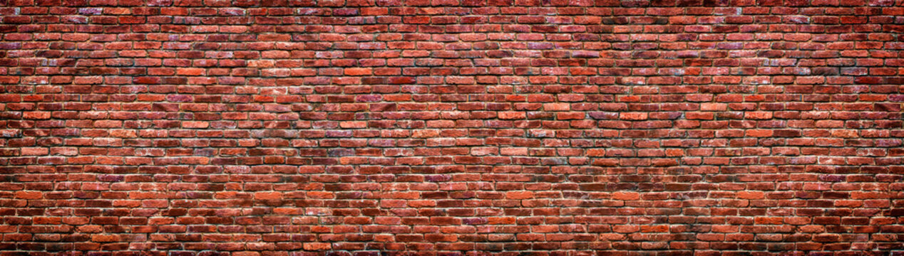 Fototapeta Old brick wall background. Panoramic texture of red stone.