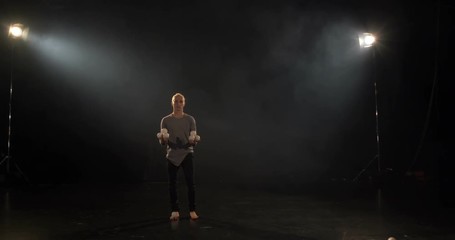 Amazing trick of professional juggler with 9 balls in slow motion.