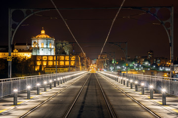 Fototapeta na wymiar Night Porto, metallic famous Dom Luis bridge .