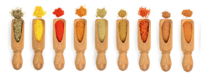 mix of spices in wooden scoop isolated on a white background. Top view. Flat lay. Set or collection