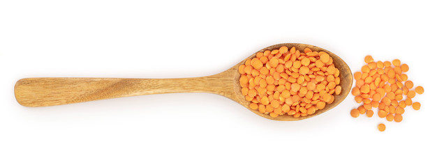 red lentil in wooden spoon isolated on white background. Top view