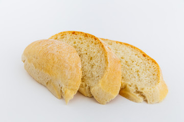 Fresh sliced ciabatta bread on a white background