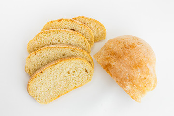 Fresh sliced ciabatta bread on a white background