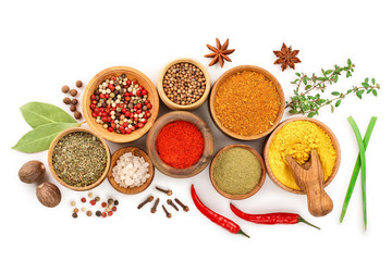 mix of spices in wooden bowl isolated on a white background. Top view. Flat lay. Set or collection
