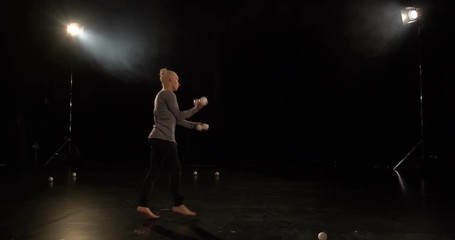 4k slow motion - Circus juggler makes amazing acrobatic tric.