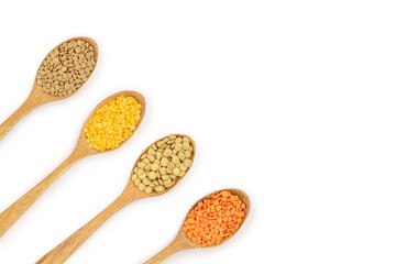 yellow, red end green lentil in wooden spoon isolated on white background with copy space for your text. Top view