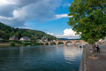 Fototapeta na wymiar Old bridge by river