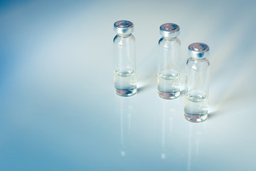 Medical glass vials and syringe for vaccination. Medical concept. Toning.
