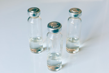 Medical glass vials and syringe for vaccination. Medical concept