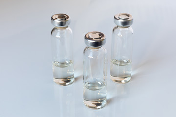 Medical glass vials and syringe for vaccination. Medical concept